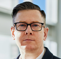Alexander Hughes, CEO firmy działającej w obszarze handlu kryptowalutami, portret